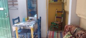 a toy room with a table and chairs and a mirror at GRUTA da Praia 2 in Saquarema