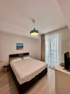 En eller flere senge i et værelse på Happy Family Lamera Residence + 26 billeder