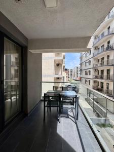 En balkon eller terrasse på Happy Family Lamera Residence