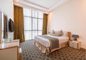 Postel nebo postele na pokoji v ubytování De Hotel Belwood Near IGI Delhi Airport