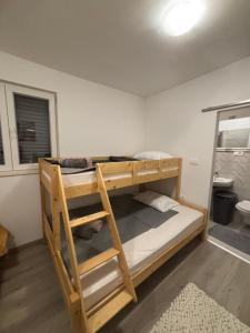 Postel nebo postele na pokoji v ubytování Apartman Rita
