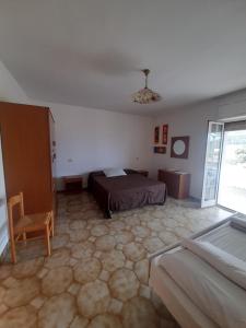 Ένα ή περισσότερα κρεβάτια σε δωμάτιο στο Villa Maria