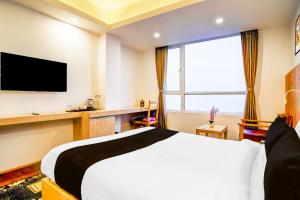 Ένα ή περισσότερα κρεβάτια σε δωμάτιο στο Hotel O Himalaya Gangtok