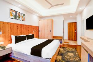 Ένα ή περισσότερα κρεβάτια σε δωμάτιο στο Hotel O Himalaya Gangtok