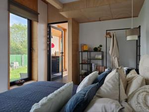 a bedroom with a bed and a large window at Villa Selya - Private Pool & Mountain View in Selyanin