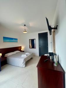 Letto o letti in una camera di Rooms del Moro