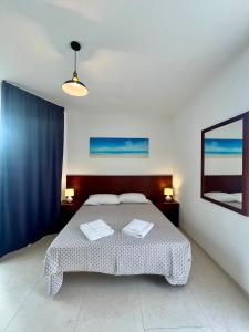 Letto o letti in una camera di Rooms del Moro