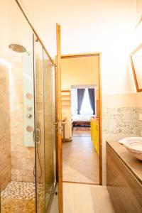 a bathroom with a shower and a glass door at Casa Petra in Sibiu