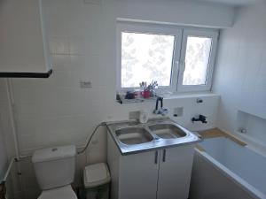 a small bathroom with a sink and a toilet at Apartament Ogrodowa in Biała Podlaska +16 photos