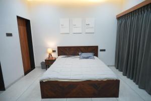 Postel nebo postele na pokoji v ubytování Sukoon Farmhouse