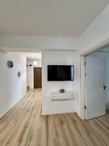 Et tv og/eller underholdning på Happy Family Lamera Residence