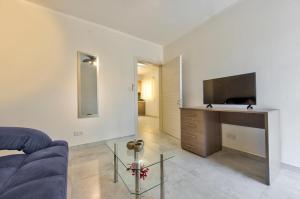 TV a/nebo společenská místnost v ubytování Central Suites