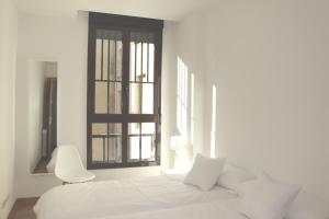 Łóżko lub łóżka w pokoju w obiekcie Aloha Hostel