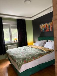 Una cama o camas en una habitación de Apartman Diana