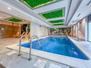 a swimming pool in a house with a swimming poolvisor at Ognjen in Zlatibor