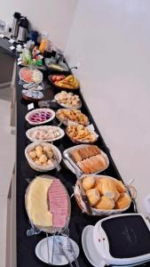 a long table filled with different types of food at HOTEL TABARANA in Ubarana