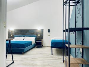 Voodi või voodid majutusasutuse Nautilus B&B toas