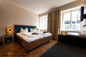Postel nebo postele na pokoji v ubytování Hotel Gasthof zur Post