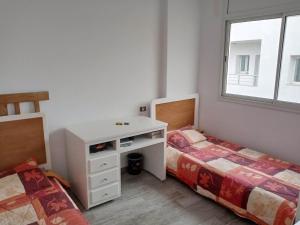 Postel nebo postele na pokoji v ubytování Appartement ksila