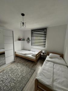 Postel nebo postele na pokoji v ubytování Home in Sarajevo
