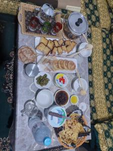 a table with many different types of food on it at imintanoute abderrahim in Oulad Akkou +6 photos