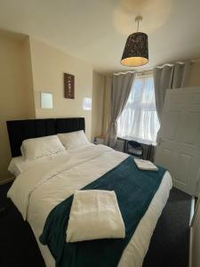 Кровать или кровати в номере Cosy home in the City Centre
