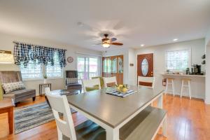 a dining room and living room with a table and chairs at Hike, Fish and More Home on 5 Acres in Crossville! in Crossville