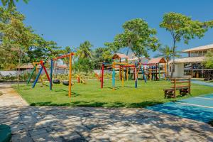 a park with a playground with a slide at GB03 Maravilhosa Casa 5 Suítes a 200m da Praia in Guarajuba