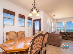 a dining room and living room with a table and chairs at 3-Bedroom El Dorado Ranch Rental with Beach View in San Felipe