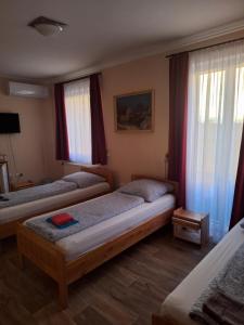 Postel nebo postele na pokoji v ubytování Hotel Amarillis