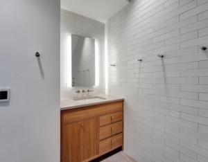 a bathroom with a sink and a mirror at Elevated Living in the Hills in Portland +14 photos