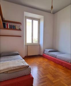 En eller flere senge i et værelse på La Finestra Sul Mare