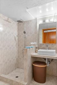 a bathroom with a sink and a shower at Malona Nostalgia in Malona Village