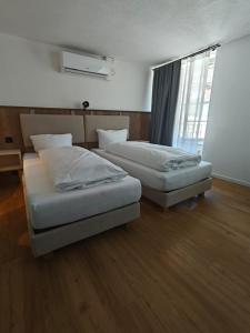 En eller flere senger på et rom på Gasthof zur Waag