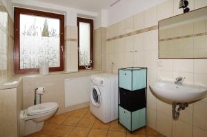 Koupelna v ubytování Ostseebad-Karlshagen-gefaellige-Ferienwohnung-Winter + 23 fotografií