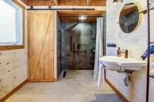a bathroom with a sink and a shower at OTIS Nature in Lamarche +88 photos