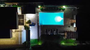 a person sitting in a chair in front of a screen at Delta apartments in Bihać