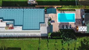 an overhead view of a building with a swimming pool at Delta apartments in Bihać +46 photos