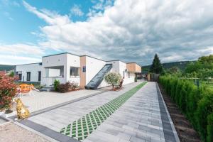 a house with a courtyard with a staircase at Delta apartments in Bihać