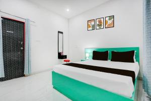 Ένα ή περισσότερα κρεβάτια σε δωμάτιο στο Hotel O Online