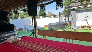 a screened in porch with a hammock in a yard at Garkov Hause in Gigen