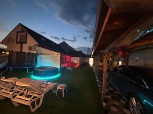 a backyard with a pool and chairs and a house at Garkov Hause in Gigen