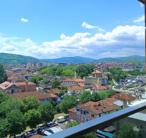 a view of a city from a balcony at Sky Apartment in Novi Pazar