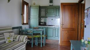 Kuchyň nebo kuchyňský kout v ubytování Agriturismo Il Rustico