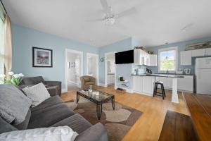 a living room with a couch and a table at The Violet - 42 Meadow View in Cherry Valley +88 photos