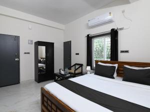 Postel nebo postele na pokoji v ubytování SS INN Hotel