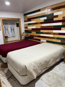 Cama ou camas em um quarto em Pé do Castelo Casinha - pet friendly & garage
