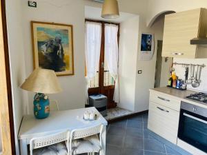 a kitchen with a table with a lamp on it at laCasetta 1 delight for 2 in Capranica Prenestina