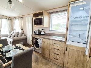 a kitchen and living room of a caravan at The Ticehurst Haven in Westgate-on-Sea