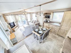 an aerial view of a living room and kitchen in a rv at The Ticehurst Haven in Westgate-on-Sea